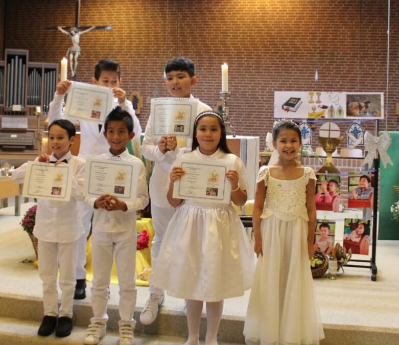 Six children receive their first Holy Communion